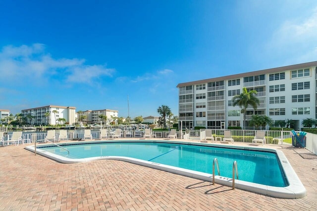 view of swimming pool with a patio