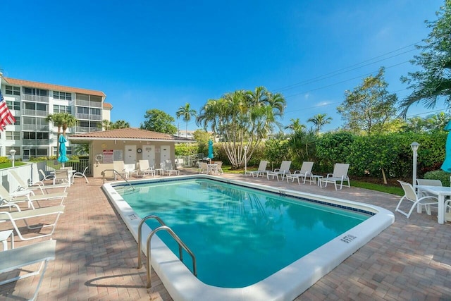 view of swimming pool featuring a patio area