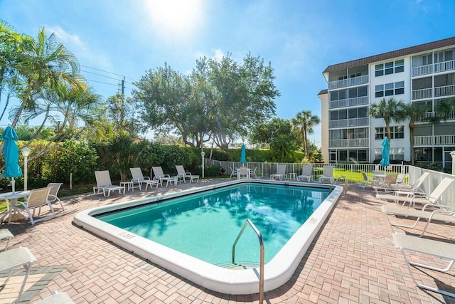 view of swimming pool with a patio area