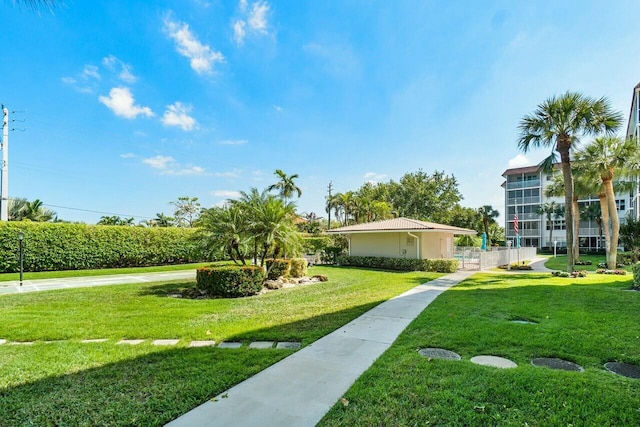 view of home's community with a lawn