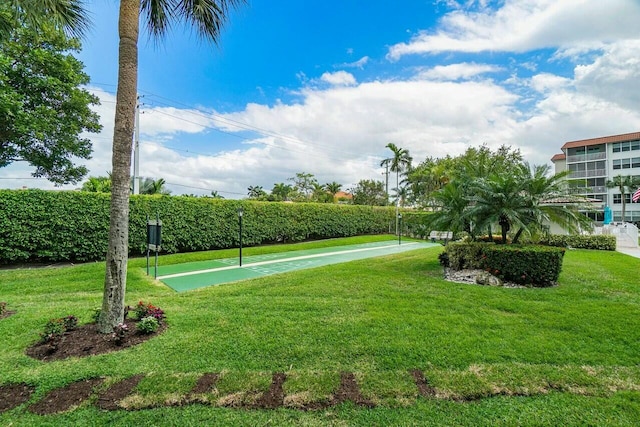 view of home's community featuring a yard