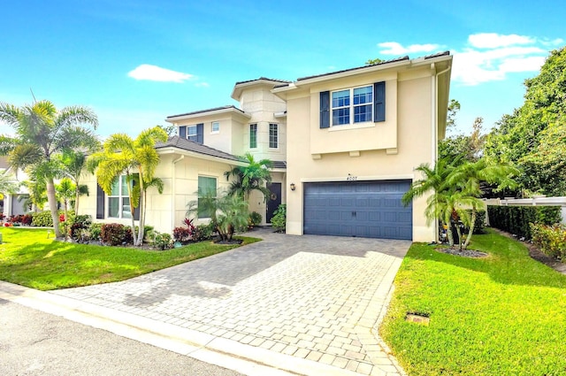 view of front of house featuring a front yard and a garage