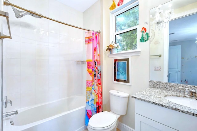 full bathroom featuring vanity, toilet, and shower / tub combo