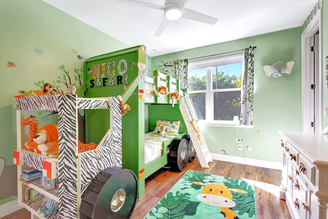 recreation room featuring light hardwood / wood-style flooring and ceiling fan