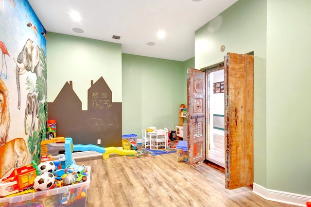 game room featuring hardwood / wood-style floors