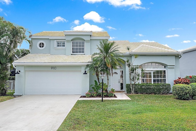 view of front of house featuring a garage and a front yard