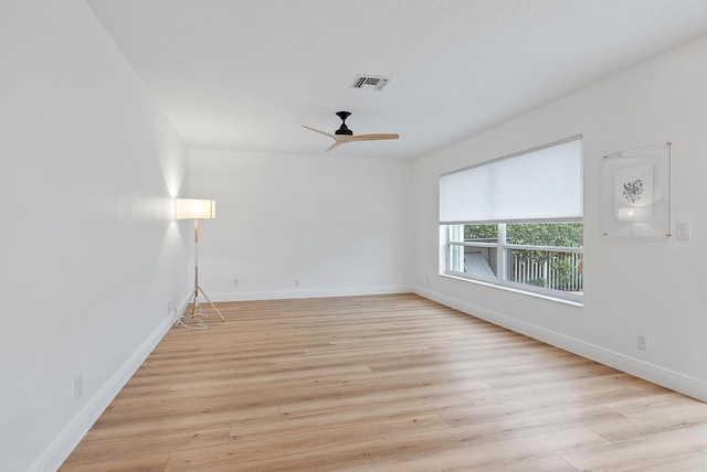 unfurnished room featuring light hardwood / wood-style floors and ceiling fan