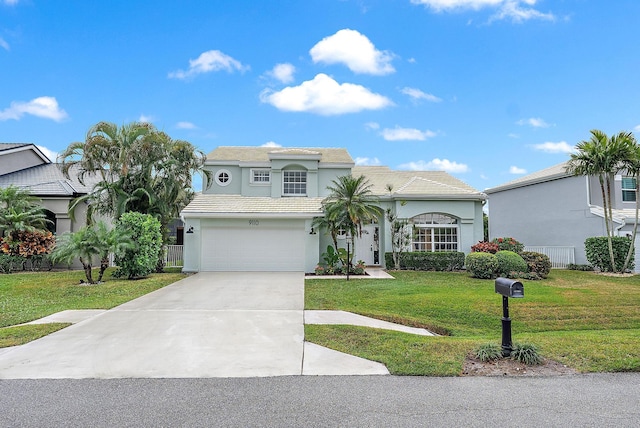 view of front facade with a garage and a front yard