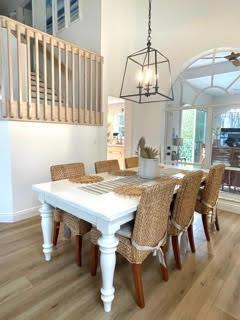 dining room featuring a chandelier and light hardwood / wood-style flooring