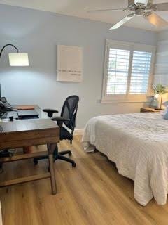 bedroom featuring ceiling fan and wood-type flooring