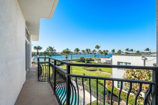 balcony featuring a water view