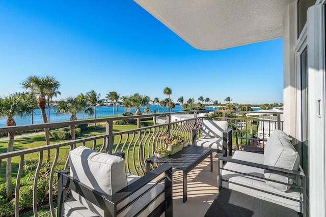 balcony featuring a water view