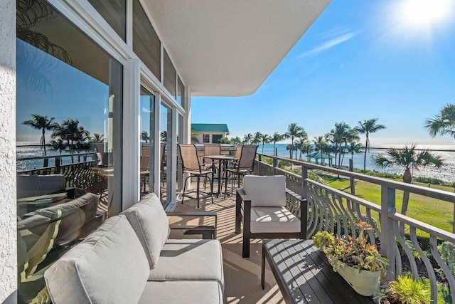 balcony featuring a water view