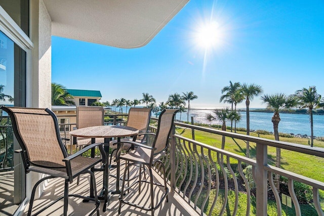 balcony featuring a water view