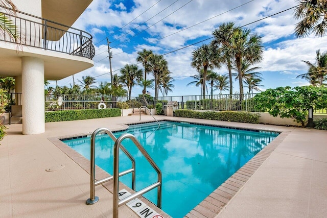 view of swimming pool with a patio