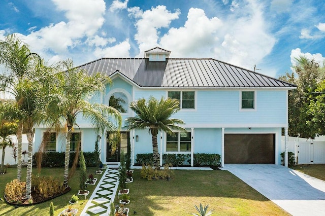 view of front facade featuring a garage and a front yard