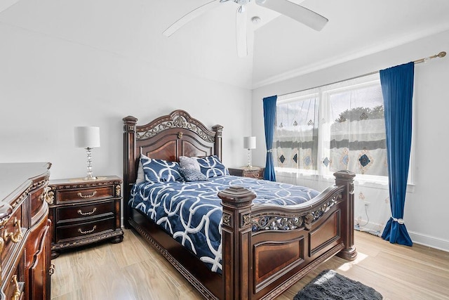 bedroom with lofted ceiling, ceiling fan, and light hardwood / wood-style flooring