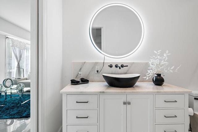 bathroom with vanity and decorative backsplash