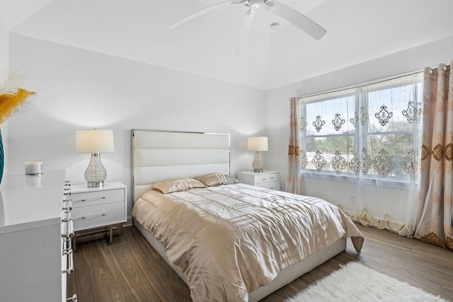 bedroom featuring dark hardwood / wood-style flooring and ceiling fan