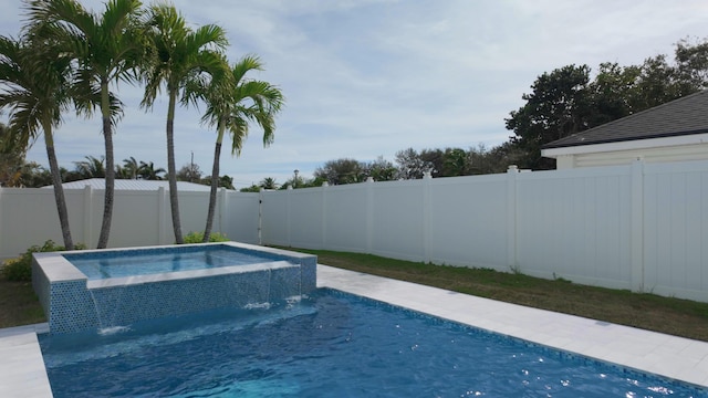 view of swimming pool featuring an in ground hot tub and pool water feature