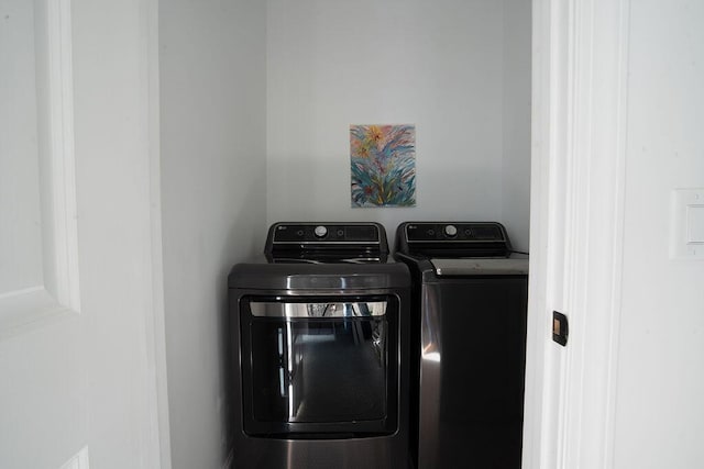 laundry room featuring washing machine and dryer