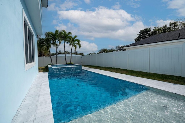 view of pool with an in ground hot tub