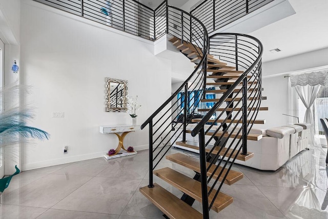 staircase with tile patterned flooring