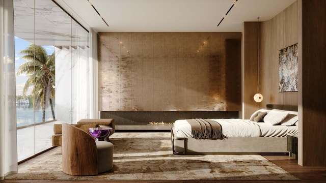 living area featuring hardwood / wood-style flooring and a wall of windows