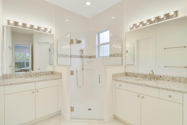 11263 SW Visconti Way, Port Saint Lucie, FL 34986 - ensuite bathroom with a shower stall, two vanities, and marble look tile flooring