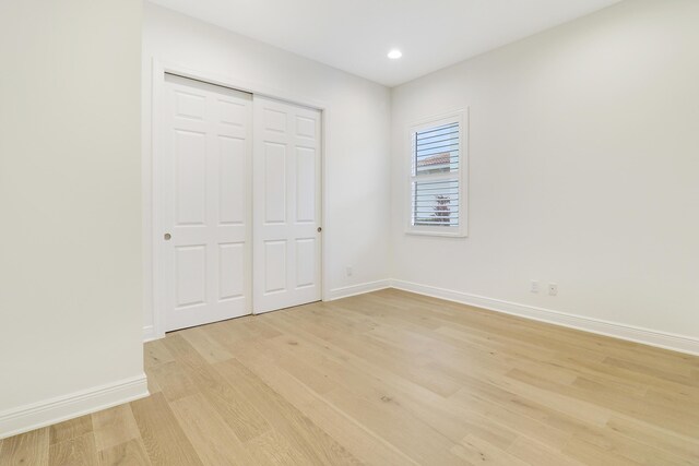 11263 SW Visconti Way, Port Saint Lucie, FL 34986 - unfurnished bedroom featuring light wood-style floors, recessed lighting, and a closet