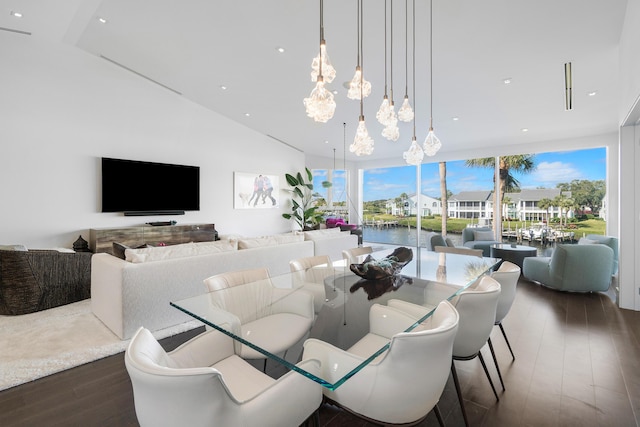 dining area featuring a notable chandelier and dark wood-type flooring