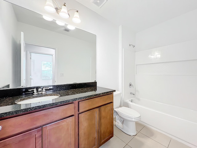 full bathroom featuring toilet, vanity, tile patterned floors, and tub / shower combination