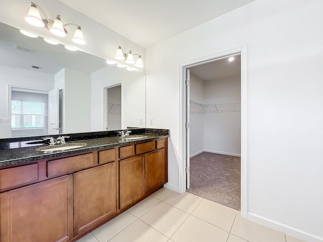 bathroom featuring tile patterned floors and vanity