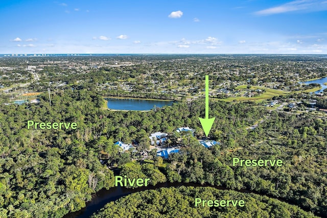 bird's eye view with a water view and a view of trees