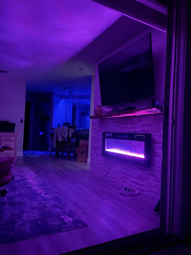 interior space featuring a glass covered fireplace