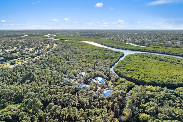 bird's eye view with a water view and a view of trees