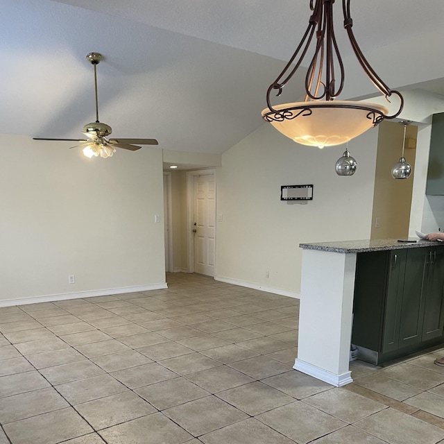 interior space with light tile patterned flooring, lofted ceiling, stone countertops, and ceiling fan