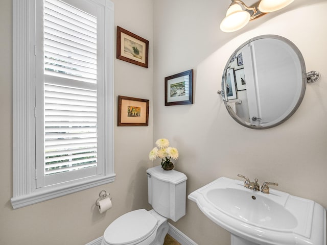 bathroom featuring sink and toilet