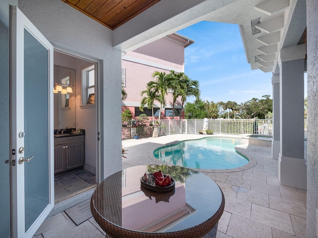 view of swimming pool featuring a patio