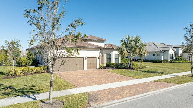 view of front of home featuring a front yard and a garage