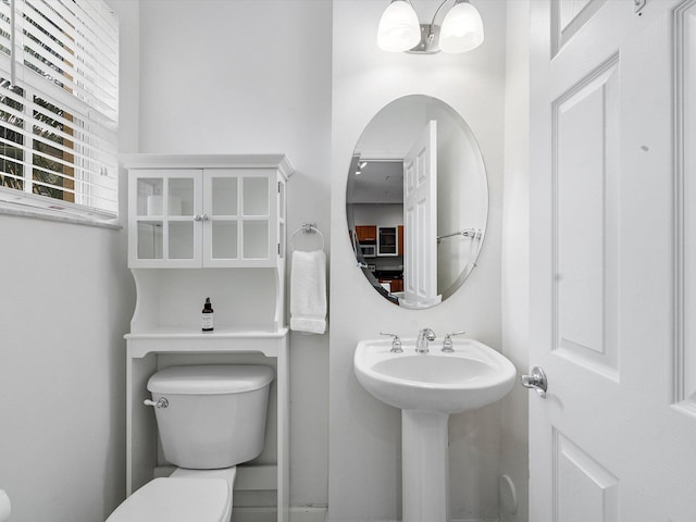 bathroom featuring toilet and sink