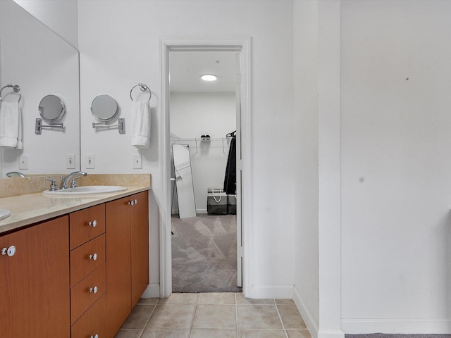 bathroom featuring tile patterned flooring and vanity