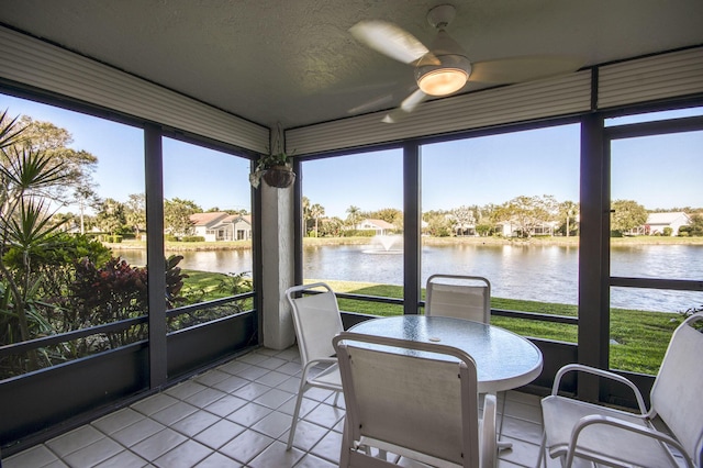 6944 Briarlake Cir Unit 101, Palm Beach Gardens, FL 33418 - sunroom / solarium with a water view, tile patterned flooring, a ceiling fan, and a textured ceiling