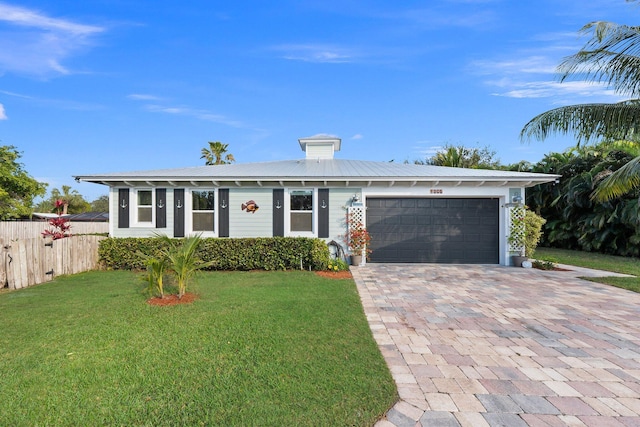 ranch-style house with a front yard and a garage