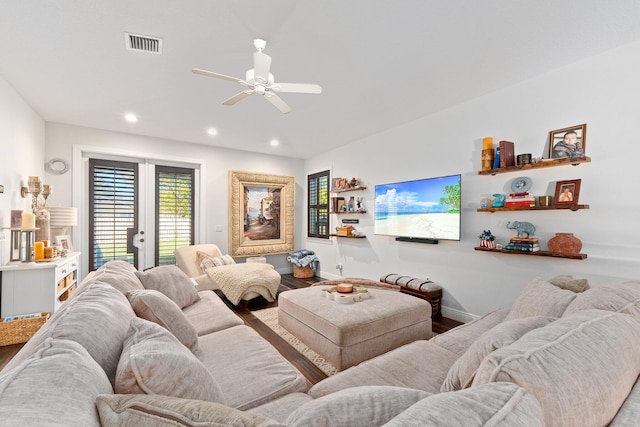 living room featuring hardwood / wood-style floors, french doors, and ceiling fan