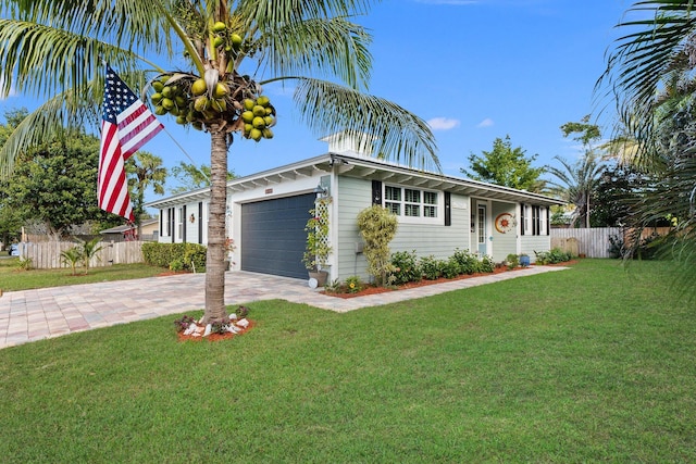 ranch-style house with a front yard and a garage