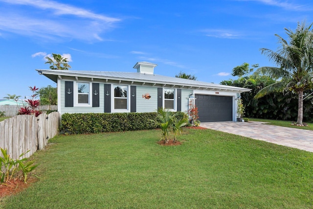 ranch-style home with a front yard and a garage