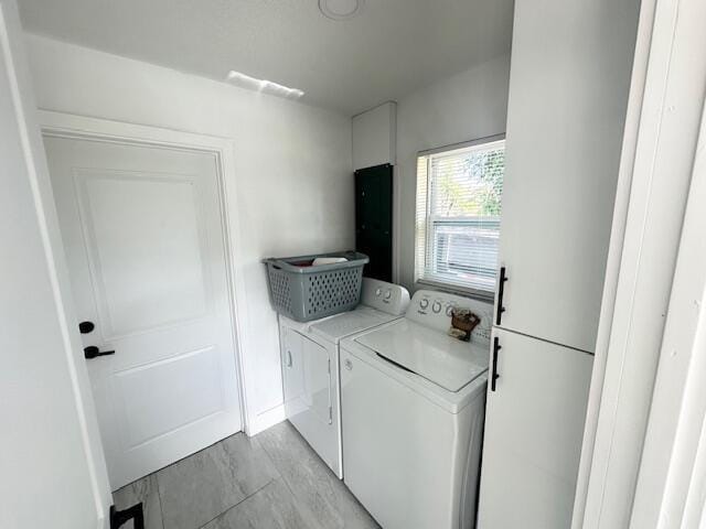 laundry area featuring separate washer and dryer