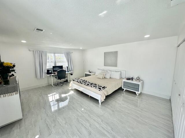 bedroom with a textured ceiling