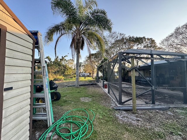 view of yard featuring a lanai